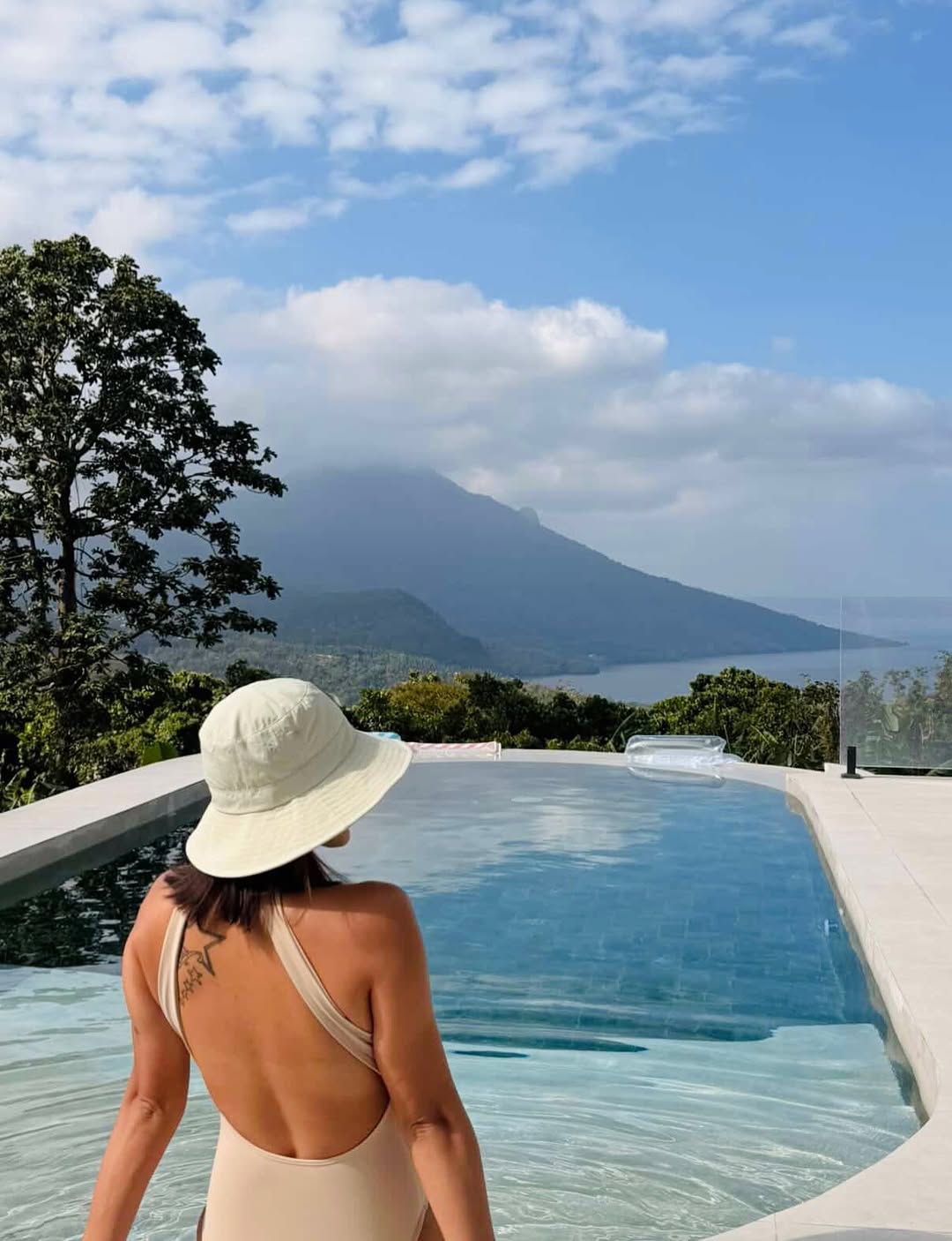 Infinity pool overlooking Taal Lake at sunrise
